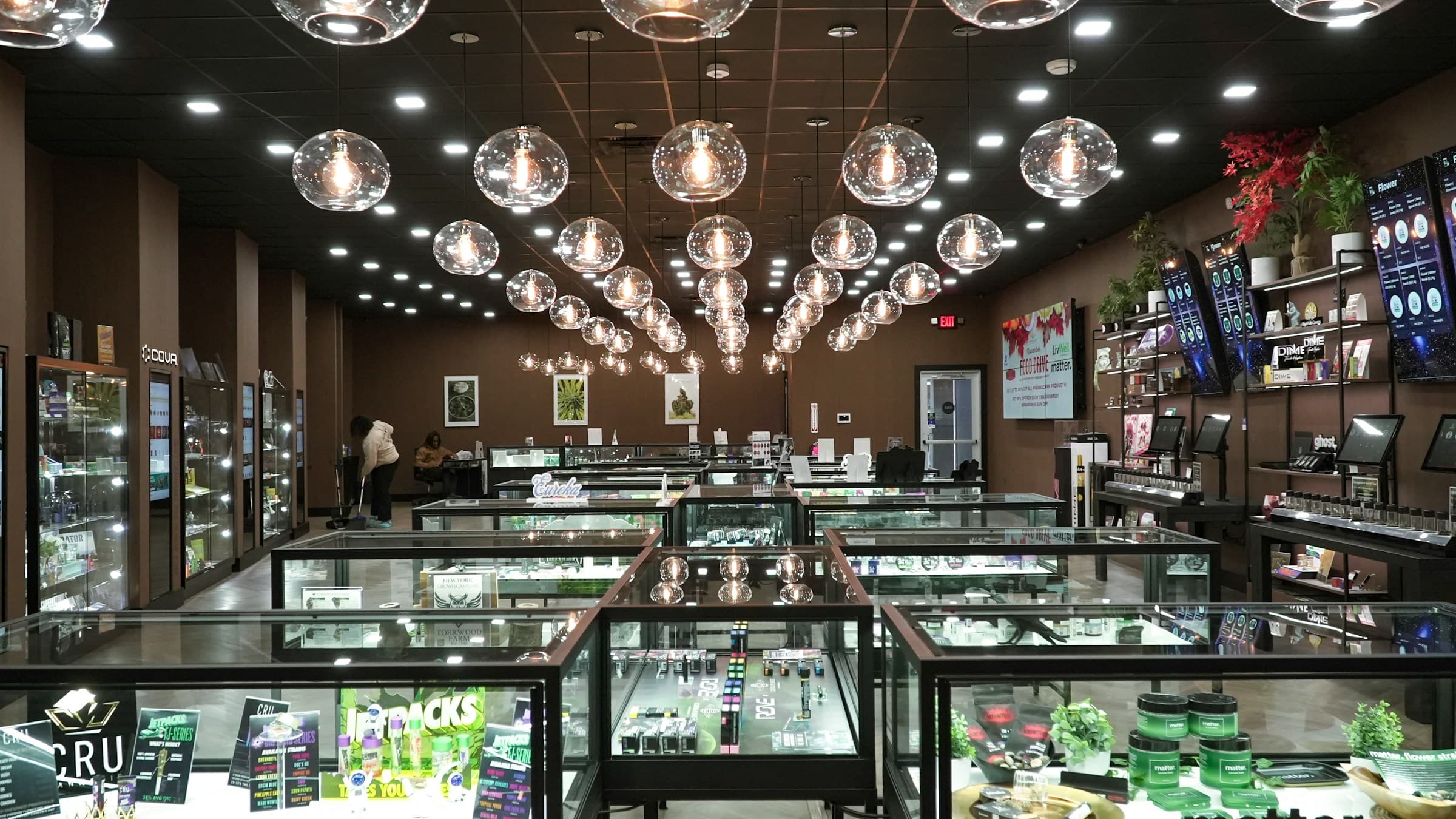 Modern retail store interior with lit displays and organized merchandise.